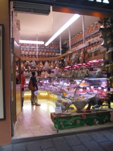 Shop selling loads of Proscuttio for those wanting to take a whole pig leg away